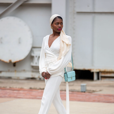 Paola Mathé wears the Serra Robe in Ivory
